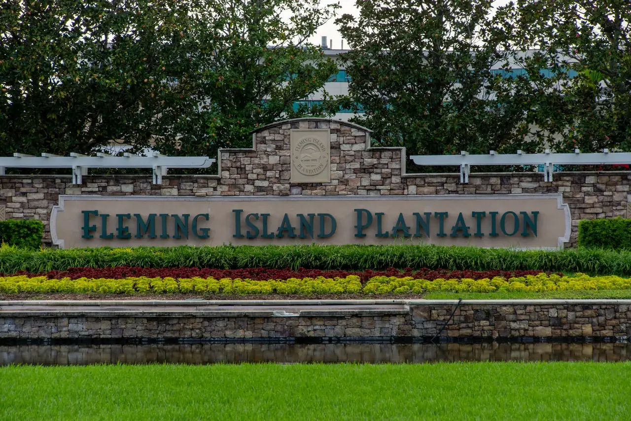 Fleming Island Plantation stone entrance sign with landscaping, Clay County, Florida